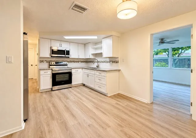 Photo 4 of Single family home for sale at 10032 Kingswood Ln, Port Richey, FL 34668 | MLS# W7890558 | Listing updated on 2026-10-23