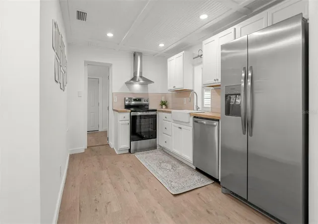 Photo 4 of Single family home for sale at 2410 NE 3rd Place, Gainesville, FL 32641 | MLS# OM734573 | Listing updated on 2026-10-25