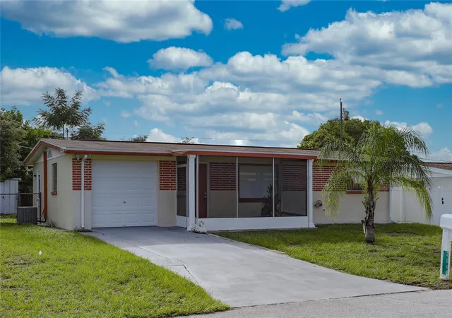 Photo 1 of Single family home for sale at 2048 Melody Dr, Holiday, FL 34691 | MLS# TB8561012 | Listing updated on 2026-10-23
