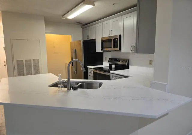Listing Photo 1 - Condo for sale in building located at 7667 N Wickham Rd, Melbourne, FL 32940 - Unit #1202
