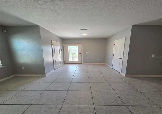 Photo 3 of Single family home for sale at 2213 Cyn Breeze Ave, Kissimmee, FL 34746 | MLS# TB8562700 | Listing updated on 2026-10-30