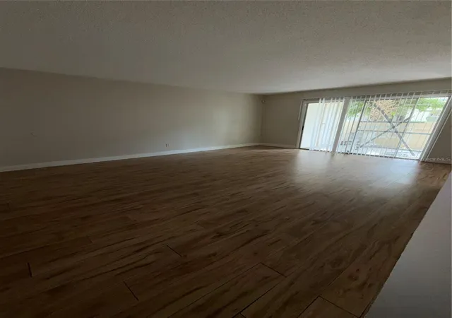 Listing Photo 1 - Condo for sale in building located at 6120 Curry Frd Rd, Orlando, FL 32822 - Unit #140