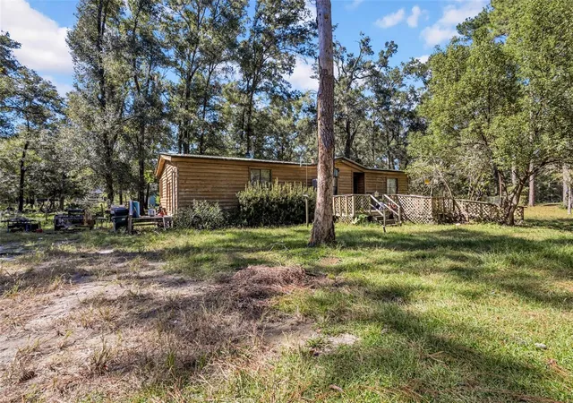 Photo 2 of Manufactured home for sale at 12150 NE 111th Avenue, Archer, FL 32618 | MLS# OM734936 | Listing updated on 2026-10-30