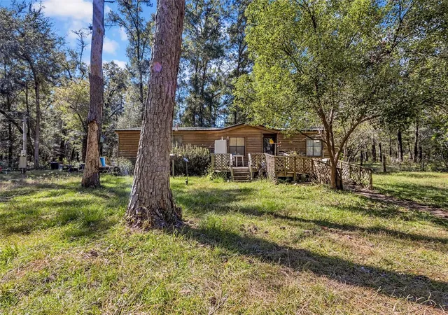 Photo 3 of Manufactured home for sale at 12150 NE 111th Avenue, Archer, FL 32618 | MLS# OM734936 | Listing updated on 2026-10-30