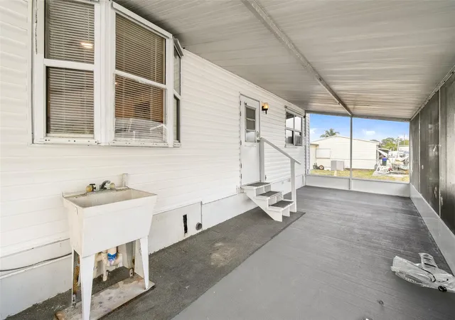 Photo 3 of Manufactured home for sale at 7897 Se Swan Ave, Hobe Sound, FL 33455 | MLS# F10501072 | Listing updated on 2026-09-23