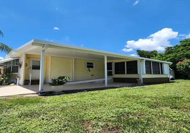 Photo 1 of Manufactured home for sale at 218 W Caribbean, Port Saint Lucie, FL 34952 | MLS# R11111711 | Listing updated on 2026-01-02