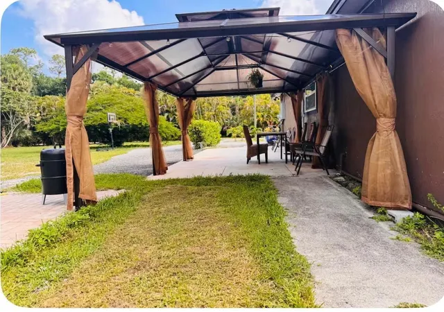 Photo 1 of Single family home for sale at 214 Westwood Cir E, West Palm Beach, FL 33411 | MLS# R11158646 | Listing updated on 2026-09-23