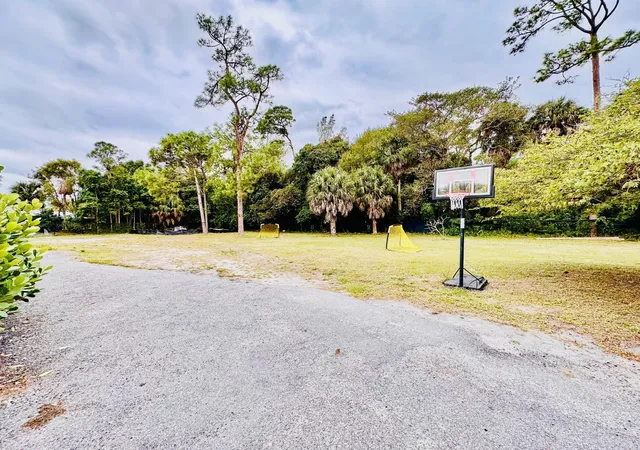 Photo 2 of Single family home for sale at 214 Westwood Cir E, West Palm Beach, FL 33411 | MLS# R11158646 | Listing updated on 2026-09-23