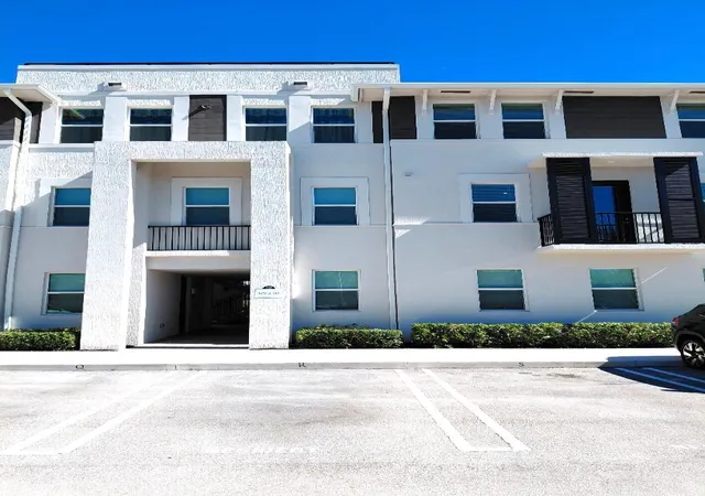Listing Photo 1 - Condo for sale in building located at 8878 Lake Worth Rd, Lake Worth Beach, FL 33467 - Unit #209