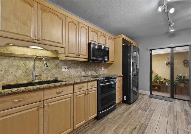 Photo 2 of Townhouse for sale at 605 Maplewood Dr, Greenacres, FL 33415 | MLS# R11160498 | Listing updated on 2026-09-23