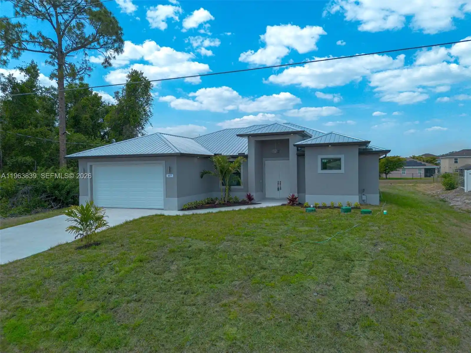 Photo 1 of Single family home for sale at 417 Paddock St, Lehigh Acres, FL 33974 | MLS# A11963839 | Listing updated on 2026-09-23