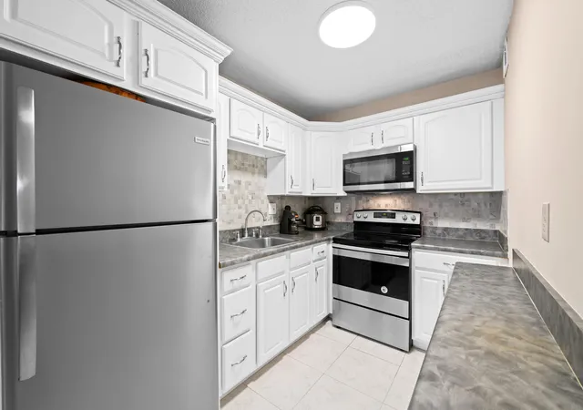 Listing Photo 1 - Condo for sale in building located at 5180 E Sabal Palm Blvd, Tamarac, FL 33319 - Unit #239
