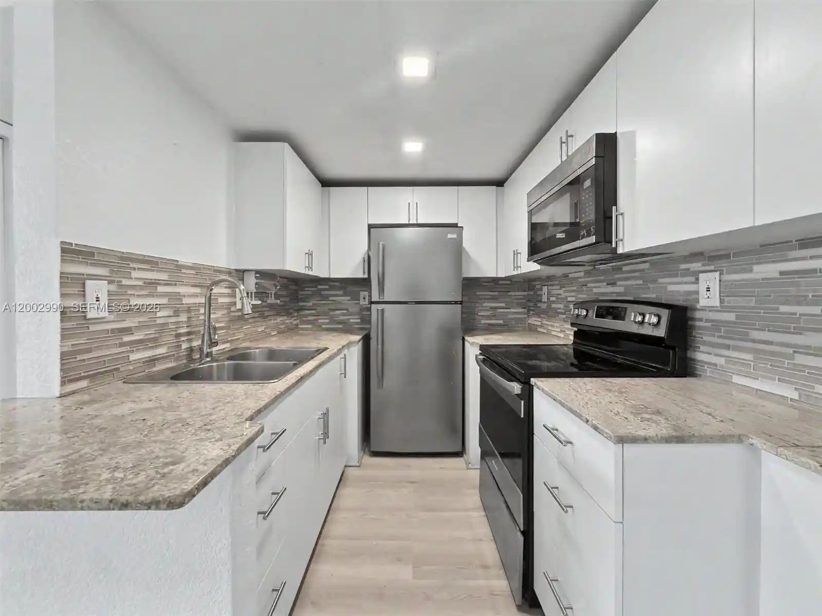 Listing Photo 1 - Condo for sale in 606 W 81St St located at 606 W 81St St, Miami, FL 33014 - Unit #120
