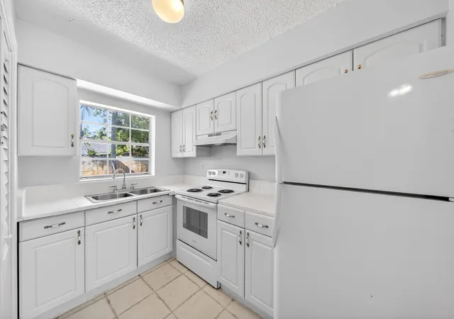 Listing Photo 4 - Condo for sale in building located at 121 NW 56th Ct, Miami, FL 33309 - Unit #1-2