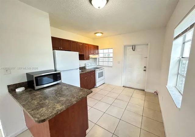 2nd image of 990 Phippen Waiters Rd, Dania, FL 33004 | MLS# A12041857