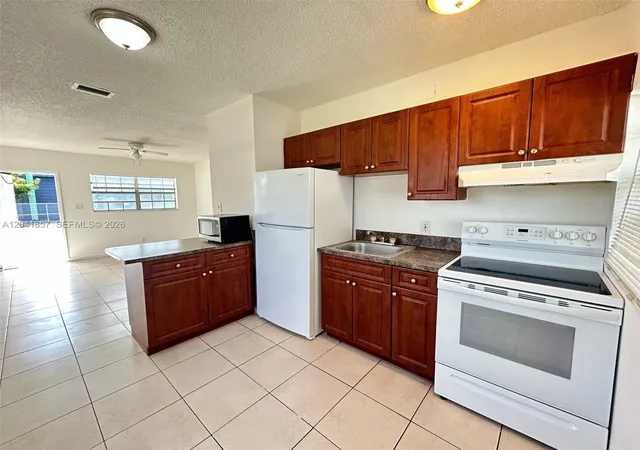 8th image of 990 Phippen Waiters Rd, Dania, FL 33004 | MLS# A12041857