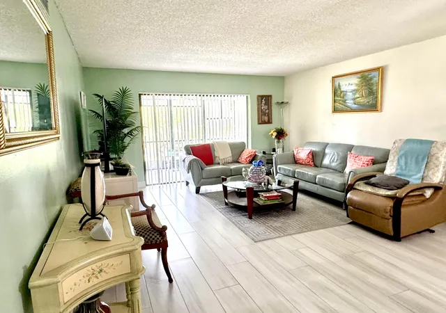 Listing Photo 2 - Condo for sale in building located at 4930 E Sabal Palm Blvd, Tamarac, FL 33319 - Unit #107