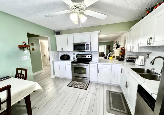 Listing Photo 3 - Condo for sale in building located at 4930 E Sabal Palm Blvd, Tamarac, FL 33319 - Unit #107