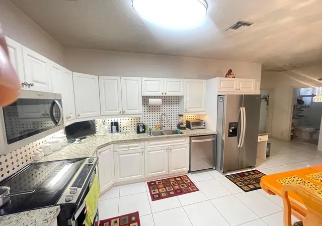 Photo 4 of House for sale at 9858 Royal Palm Blvd #3-14, Coral Springs, FL 33065 | MLS# B26048168 | Listing updated on 2026-09-28