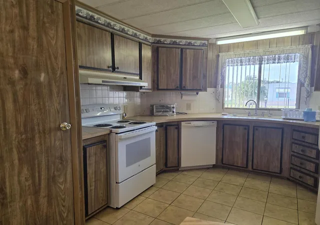 Photo 4 of Manufactured home for sale at 6937 SE Delegate St, Hobe Sound, FL 33455 | MLS# B26048829 | Listing updated on 2026-09-23