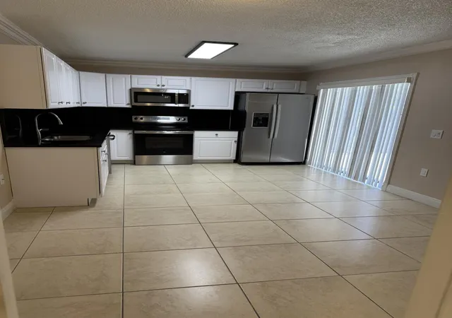 Photo 3 of Townhouse for sale at 915 9th Way, West Palm Beach, FL 33407 | MLS# B26049851 | Listing updated on 2026-09-23