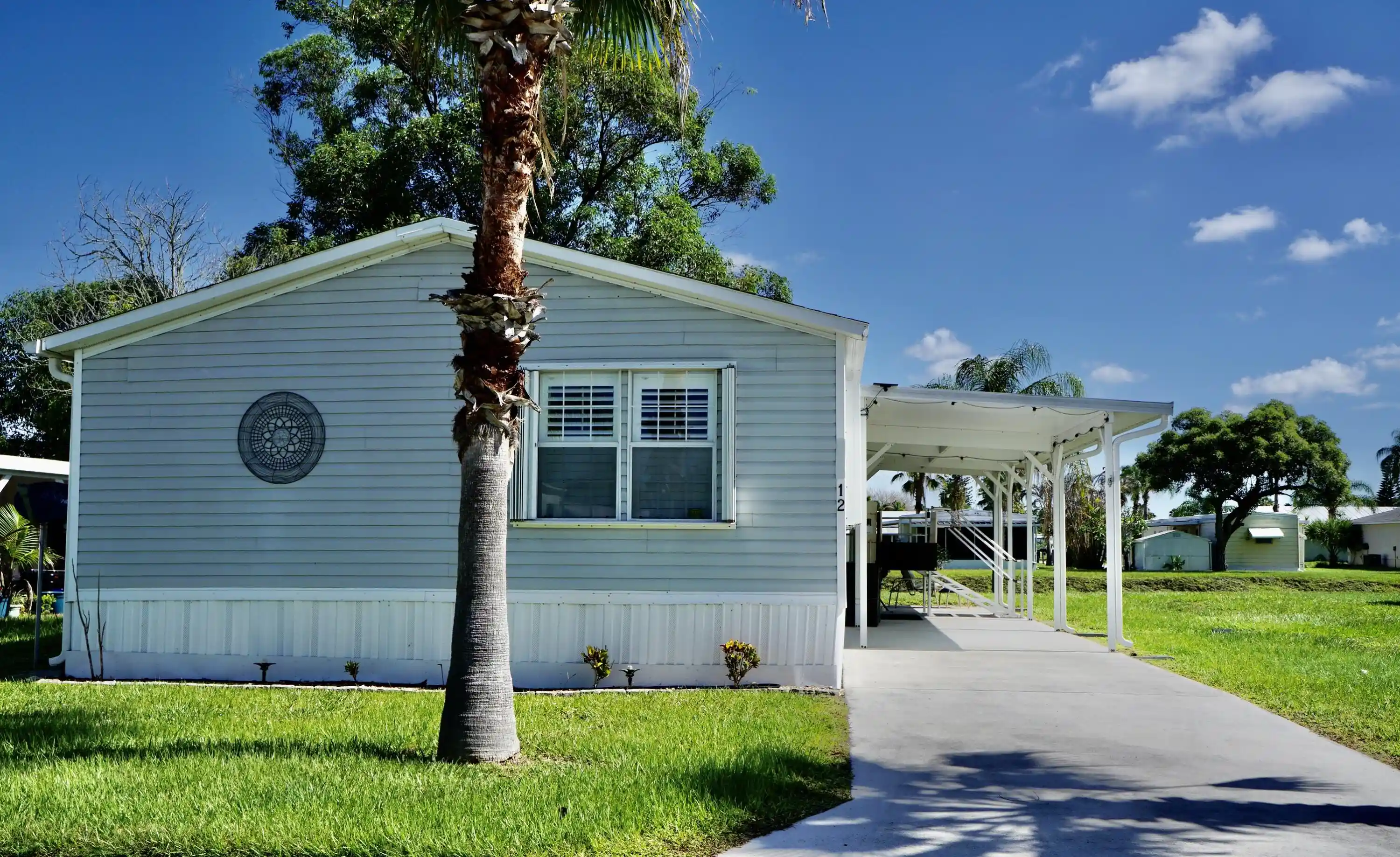 Photo 1 of Manufactured home for sale at 12 Se Spanish Way, Port Saint Lucie, FL 34952 | MLS# B26049883 | Listing updated on 2026-10-23