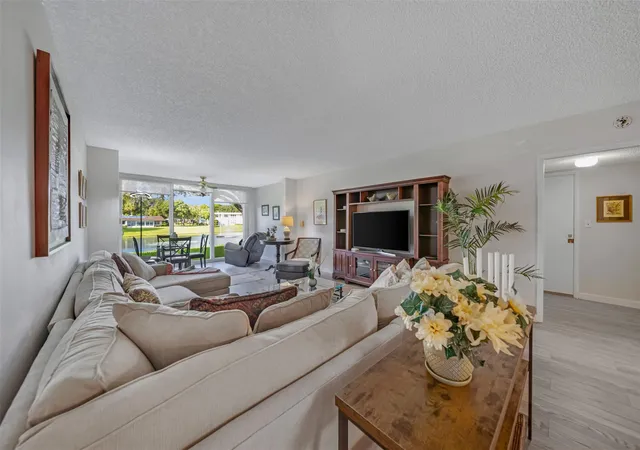 Photo 4 of Condo for sale at 3611 Oaks Clubhouse Dr #104, Pompano Beach, FL 33069 | MLS# B26052290 | Listing updated on 2026-09-23