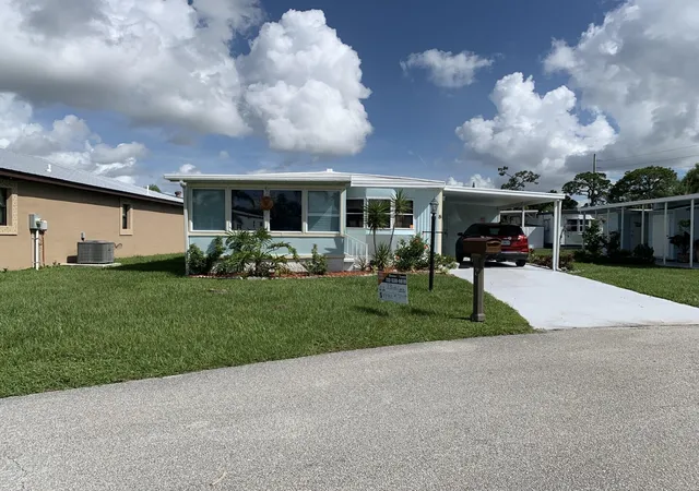 Photo 1 of Manufactured home for sale at 8 Brisa Ln, Port Saint Lucie, FL 34952 | MLS# B26054107 | Listing updated on 2026-09-23