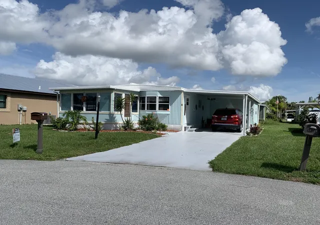 Photo 2 of Manufactured home for sale at 8 Brisa Ln, Port Saint Lucie, FL 34952 | MLS# B26054107 | Listing updated on 2026-09-23
