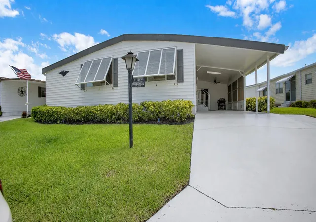 Photo 3 of Manufactured home for sale at 140 Ne Pinelake Village Blvd, Jensen Beach, FL 34957 | MLS# B26055243 | Listing updated on 2026-10-09