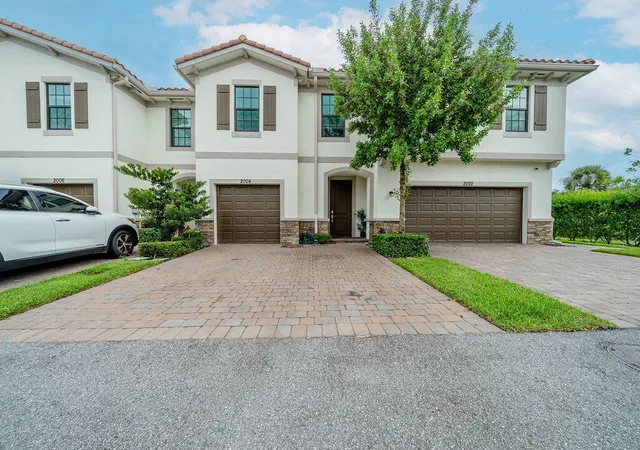 Photo 1 of Townhouse for sale at 2004 Sugar Maple Dr, Riviera Beach, FL 33410 | MLS# B26055533 | Listing updated on 2026-09-23