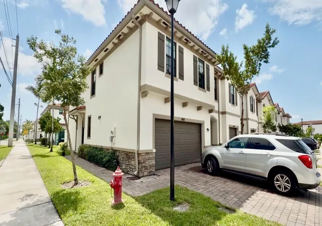 Photo 1 of Townhouse for sale at 4414 Hemlock Dr, Riviera Beach, FL 33410 | MLS# B26063429 | Listing updated on 2026-10-09