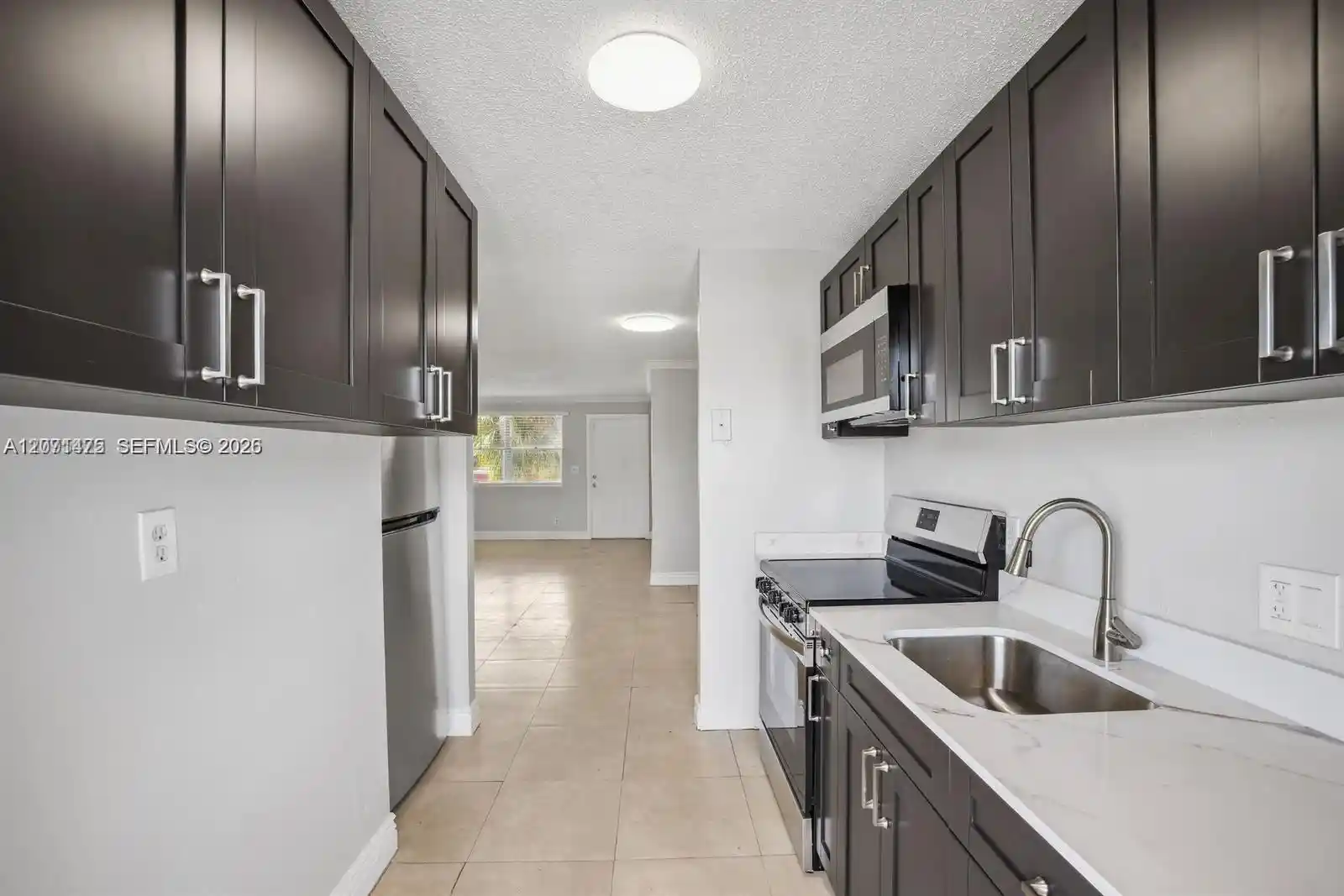 Condo for sale at 850 E Commercial Blvd #214B, Oakland Park, FL 33334 | MLS# A12071475