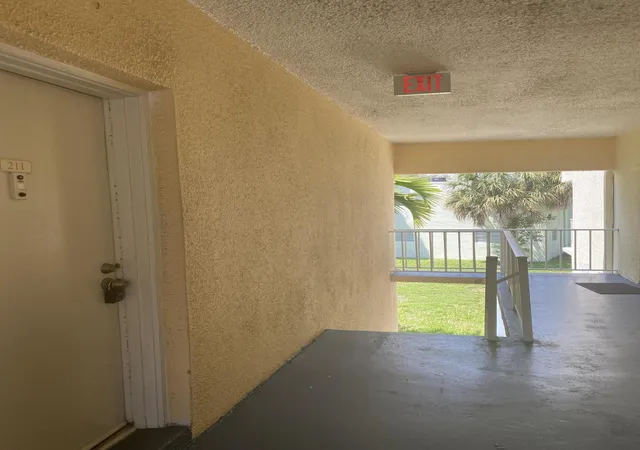 Listing Photo 1 - Condo for sale in building located at 409 Executive Ctr Dr, West Palm Beach, FL 33401 - Unit #211