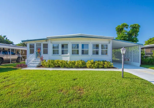 Photo 1 of Manufactured home for sale at 58 Village Ln, Jensen Beach, FL 34957 | MLS# B26066630 | Listing updated on 2026-09-23