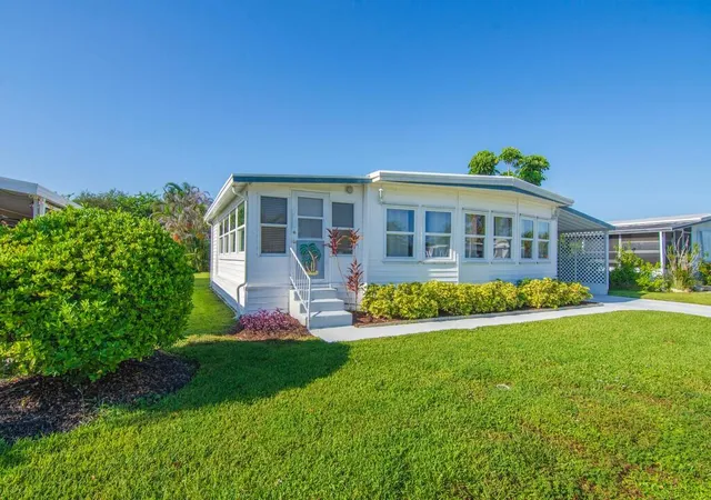 Photo 3 of Manufactured home for sale at 58 Village Ln, Jensen Beach, FL 34957 | MLS# B26066630 | Listing updated on 2026-09-23