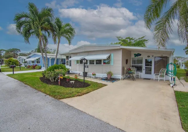 Photo 3 of Manufactured home for sale at 293 Ne Moonstone Dr, Jensen Beach, FL 34957 | MLS# B26066937 | Listing updated on 2026-09-28