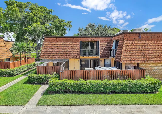 Photo 1 of Townhouse for sale at 1821 18th Ln, Greenacres, FL 33463 | MLS# B26067353 | Listing updated on 2026-10-08
