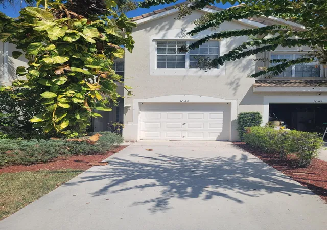 Photo 1 of Townhouse for sale at 1042 Woodfield Rd, Greenacres, FL 33415 | MLS# B26068068 | Listing updated on 2026-09-23