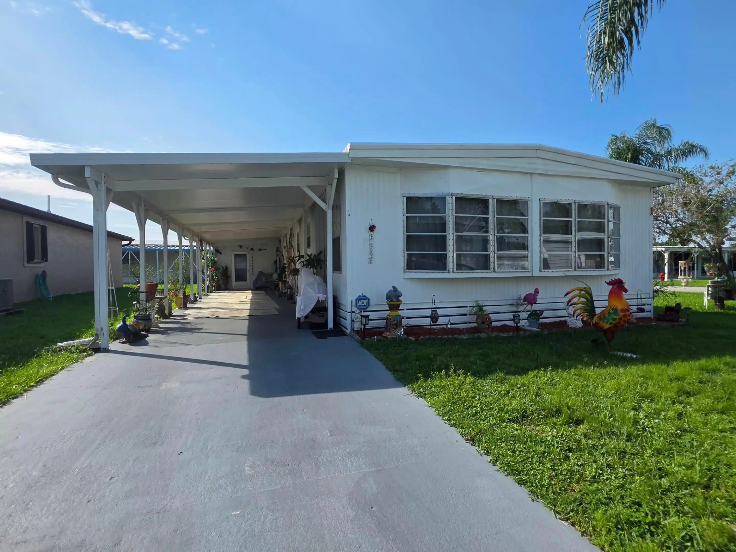 Photo 1 of Manufactured home for sale at 1 Juan Carlos Ln, Port St Lucie, FL 34952 | MLS# B26068108 | Listing updated on 2026-10-04