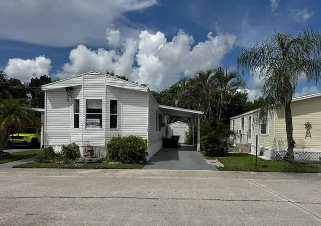 Photo 1 of Manufactured home for sale at 104 Plantation Blvd #104, Lake Worth, FL 33467 | MLS# B26072163 | Listing updated on 2026-09-30