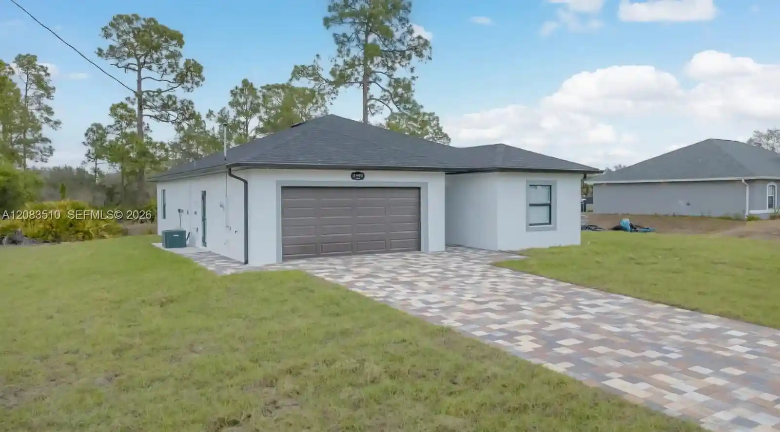 Photo 1 of Single family home for sale at 12 W 15th Street, Lehigh Acres, FL 33972 | MLS# A12083510 | Listing updated on 2026-10-30