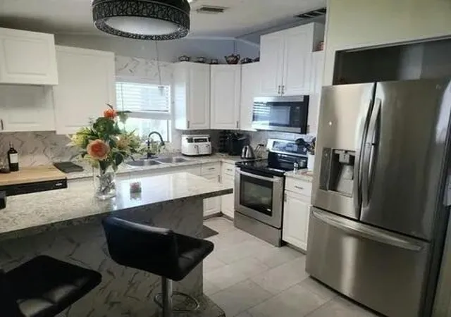 Photo 3 of Manufactured home for sale at 4748 Se Balsawood Ter, Stuart, FL 34997 | MLS# B26077646 | Listing updated on 2026-09-24