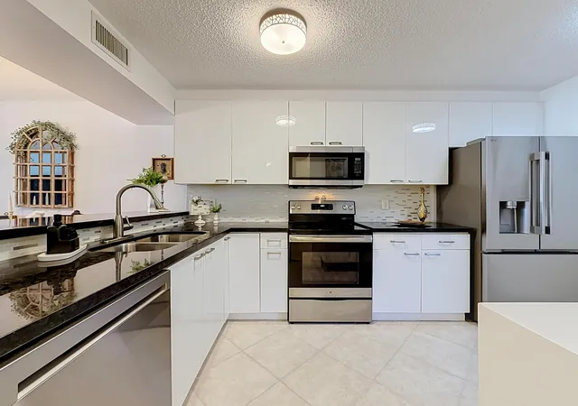 Listing Photo 1 - Condo for sale in building located at 6219 Coral Lake Dr, Margate, FL 33063 - Unit #207