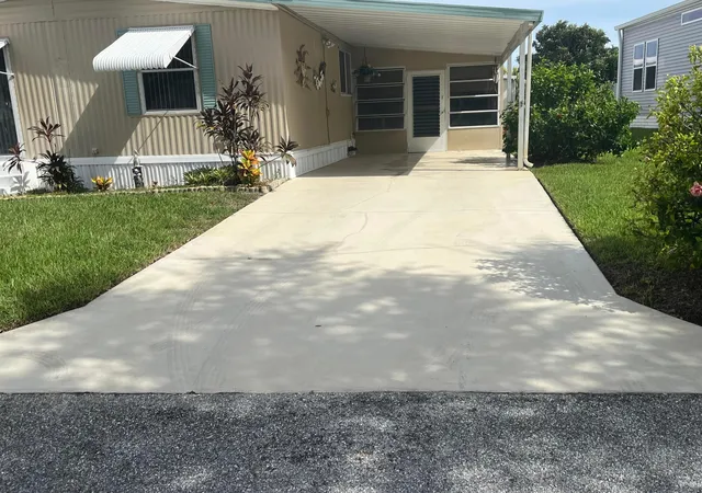 Photo 2 of Manufactured home for sale at 97 N Warner Dr, Jensen Beach, FL 34957 | MLS# B26082796 | Listing updated on 2026-10-08