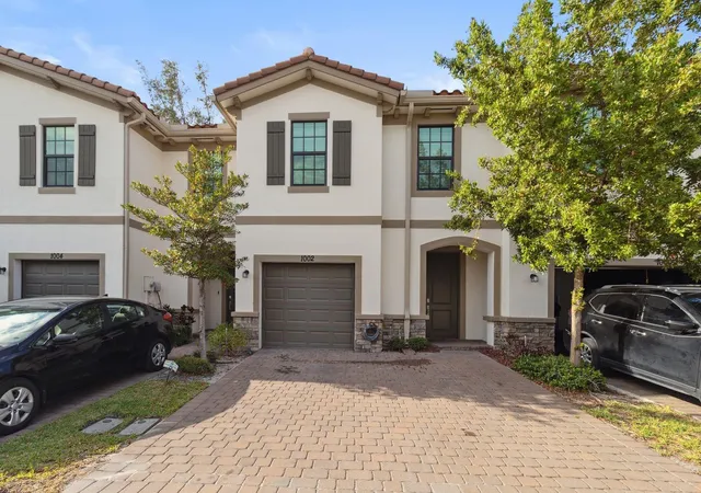 Photo 1 of Townhouse for sale at 1002 Sweet Briar Ln, Riviera Beach, FL 33410 | MLS# B26083476 | Listing updated on 2026-10-10