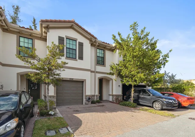 Photo 2 of Townhouse for sale at 1002 Sweet Briar Ln, Riviera Beach, FL 33410 | MLS# B26083476 | Listing updated on 2026-10-10