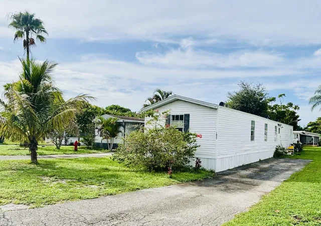 Photo 1 of Manufactured home for sale at 1027 Marco Ct, Greenacres, FL 33463 | MLS# B26083487 | Listing updated on 2026-10-08