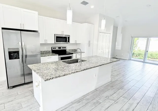 Photo 2 of Multi family home for sale at 1562 W 26th Court, Riviera Beach, FL 33404 | MLS# B26084928 | Listing updated on 2026-10-10