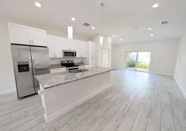 Photo 3 of Multi family home for sale at 1562 W 26th Court, Riviera Beach, FL 33404 | MLS# B26084928 | Listing updated on 2026-10-10